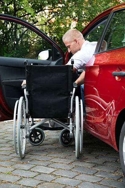 istock Handicapped Car Driver With A Wheelchair 516177900