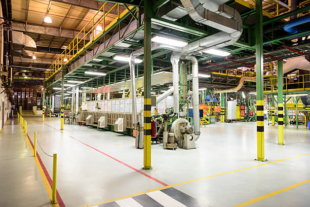 istock Pipes and industrial equipment inside aluminium processing plant 516178478
