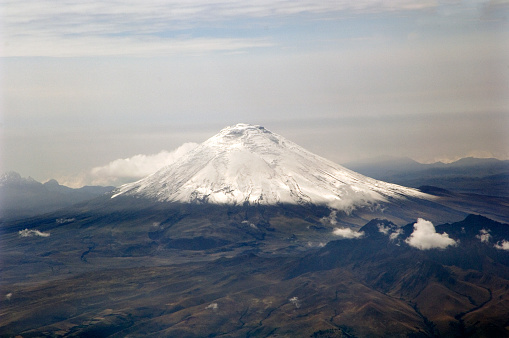 The Cotopaxi is the third highest active volcano in the world. It raises 19388 feet (5911 m) above the sea level and is located in Ecuador near Quito. Its peak is a popular destination for climbers. The yellow base station for climbers can be seen in the bottom centre of the image.