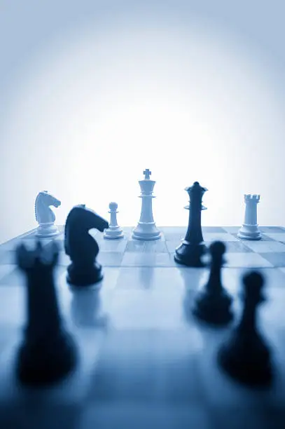 Photo of Chess pieces on board in blues