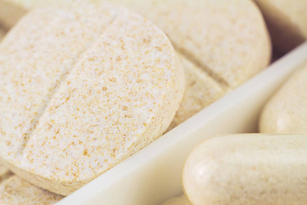 istock Mixed natural food supplement pills, macro image, selective focus 516179656