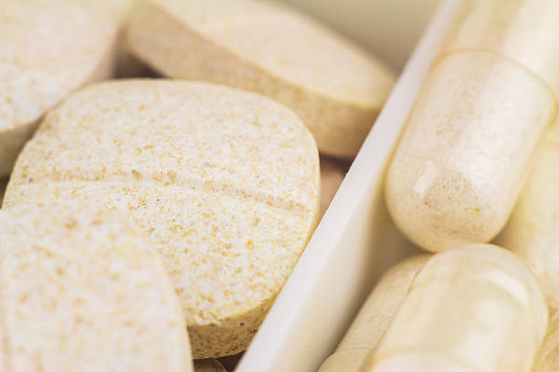 istock Mixed natural food supplement pills, macro image, selective focus 516179722