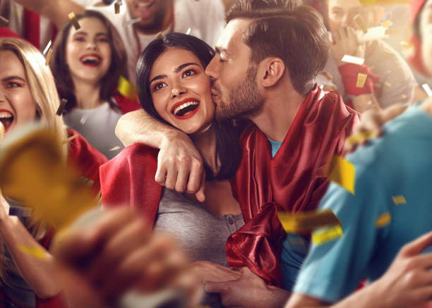 Sport fans: Man kisses woman