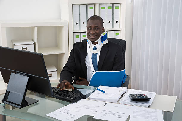 Portrait Of Young Disabled African Businessman Working In Office