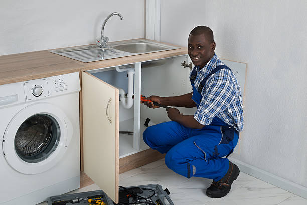 istock Male Plumber Fixing Sink In Kitchen 516183218