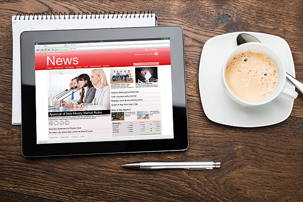 istock Tea Cup And Digital Tablet With Business News 516184736