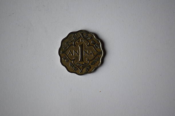 reverse view of a silver 1 Anna Coin from 1935