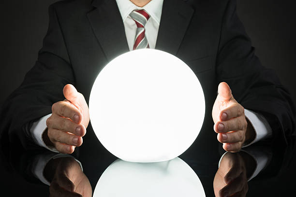 istock Businessman Predicting Future With Crystal Ball 516186654