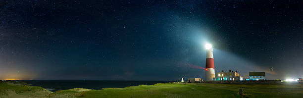 Portland Bill Lighthouse - Dorset Portland Bill Lighthouse under a night sky. bill of portland stock pictures, royalty-free photos & images