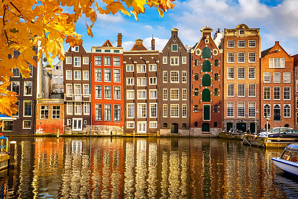 Old buildings in Amsterdam Traditional old buildings in Amsterdam, the Netherlands canal house photos stock pictures, royalty-free photos & images