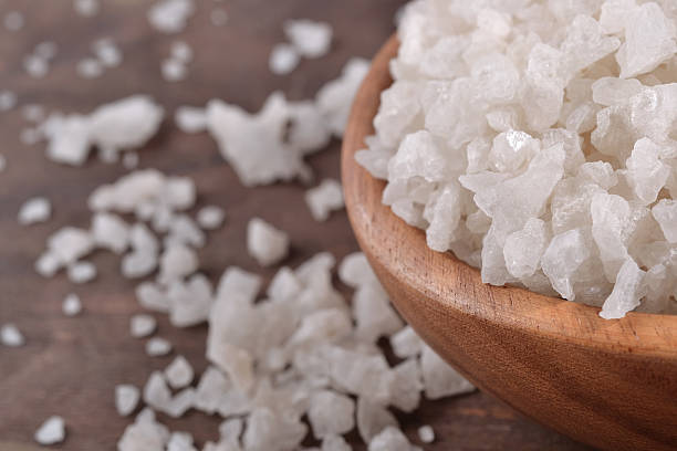 istock Sea salt in a wooden bowl 516189325