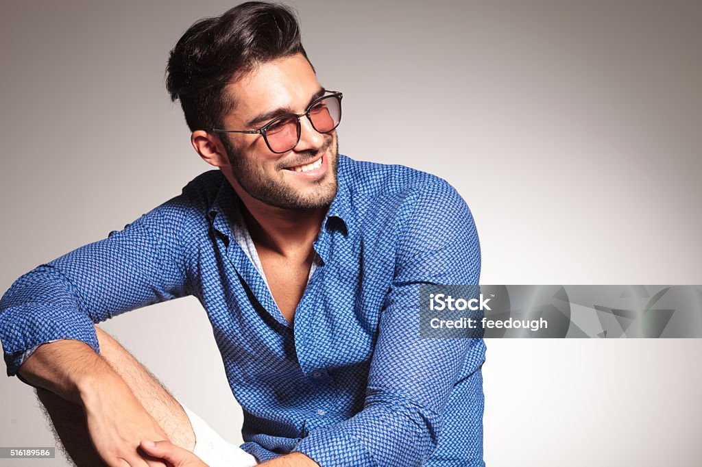 Portrait of a handsome fashion man smiling Portrait of a handsome fashion man smiling while looking away from the camera. Men Stock Photo