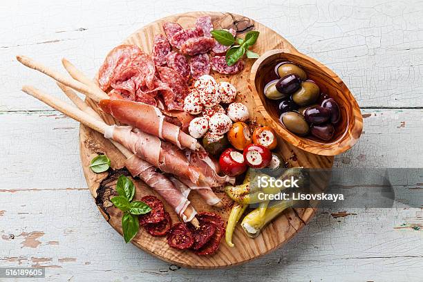 Cold Meat Plate And Bread Sticks Stock Photo - Download Image Now - Italian Food, Cutting Board, Antipasto