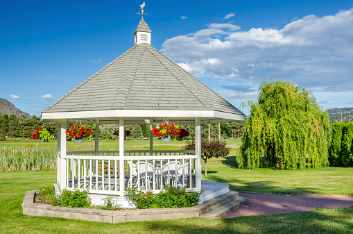 Wooden Gazebo in a Park and Blue Sky