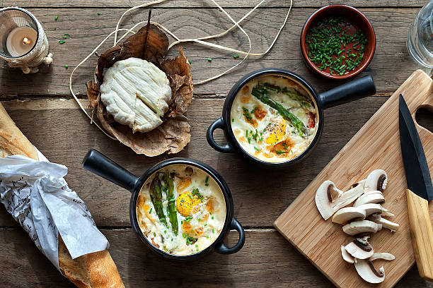 Pots with baked eggs stock photo