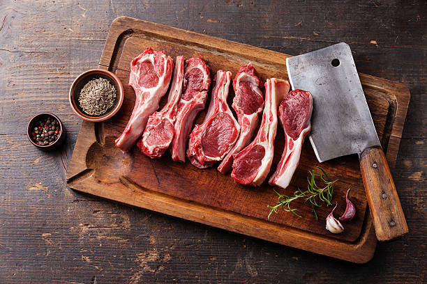 istock Raw lamb ribs and meat cleaver 516191281