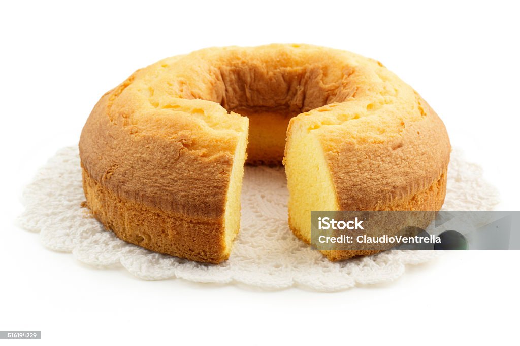 homemade cake over a doily cake over a doily isolated on white background Pound Cake Stock Photo