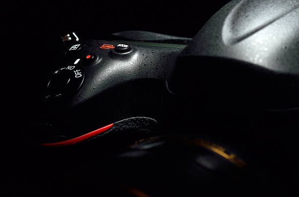 istock professional digital photo camera against black background 516194273