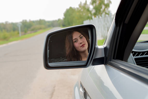 istock young girl and car 516194717