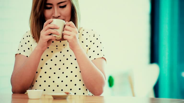 women drink coffee at coffee cafe.