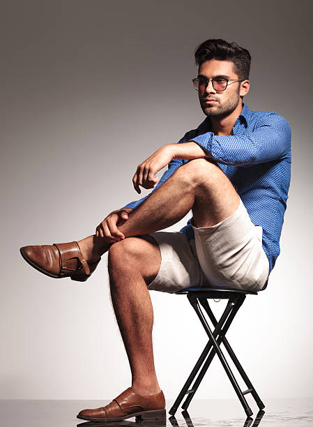 istock Smart casual young man sitting on a stool 516205424