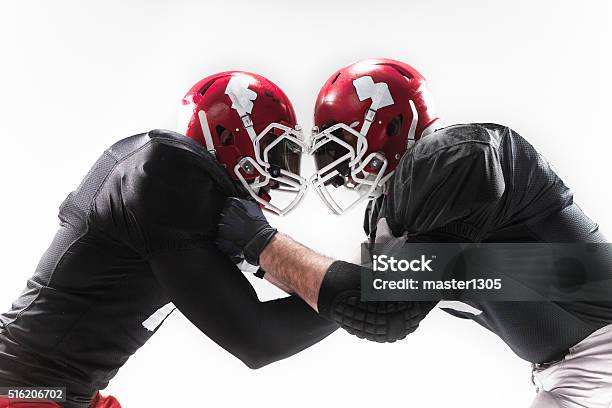 The Two American Football Players Fighting On White Background Stock Photo - Download Image Now