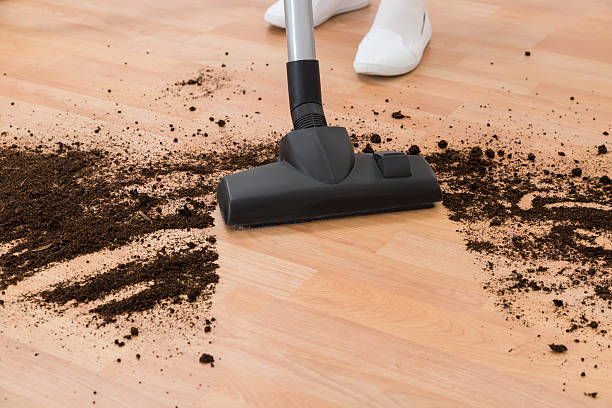 istock Person With Vacuum Cleaner Cleaning Floor 516207202