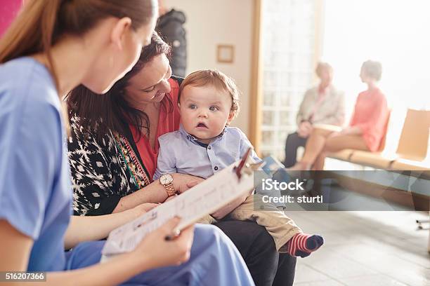 Baby Clinic Visit For Toddler And Mum Stock Photo - Download Image Now - Busy, Crowded, Doctor's Office