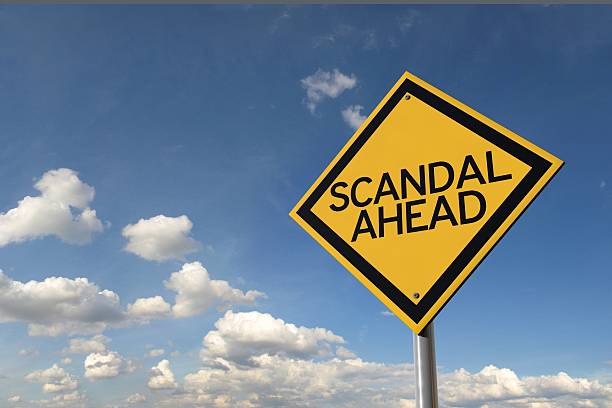 istock Scandal ahead yellow highway road sign 516207396