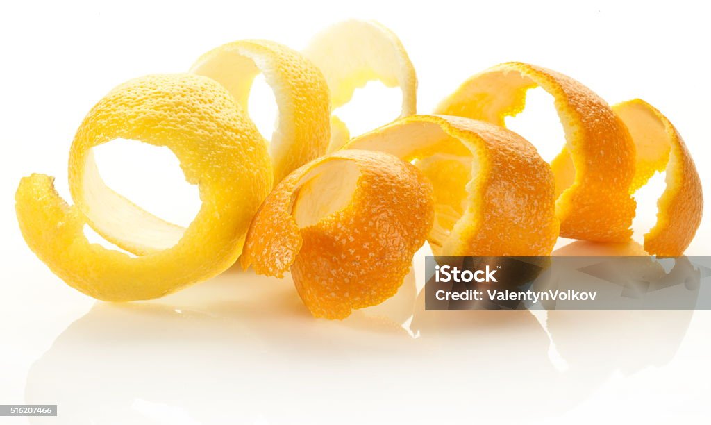Twist of citrus peel. Twist of citrus peel on a white background. Orange - Fruit Stock Photo
