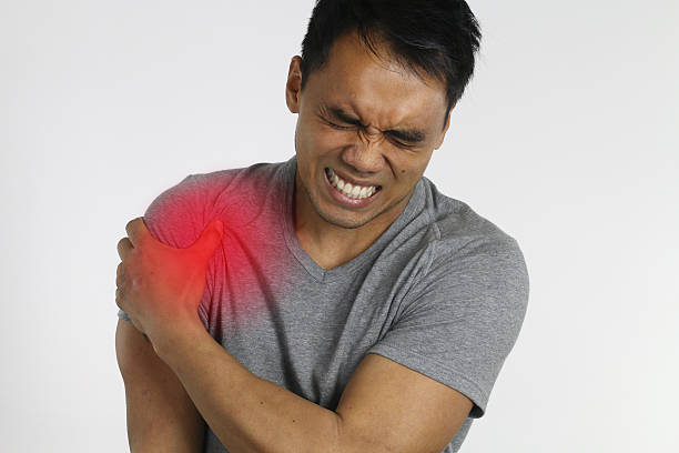 istock young man suffering from shoulder pain 516208808
