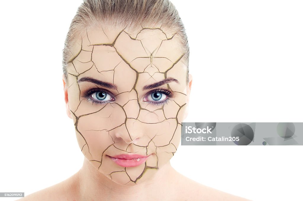 Close-up of woman cracked and damaged face Close-up of woman cracked and damaged face as cosmetic and dehydration effect concept isolated on white background Cracked Stock Photo