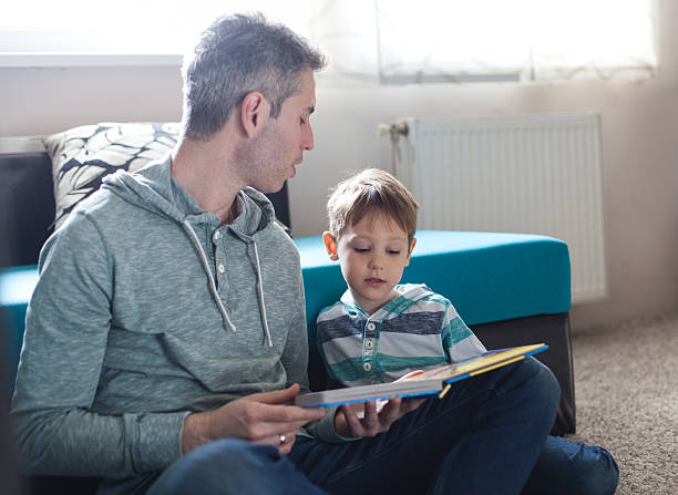 istock Father and son enjoying at home. 516210018