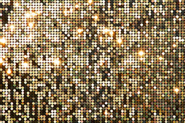 Photo of Golden background mosaic with light spots