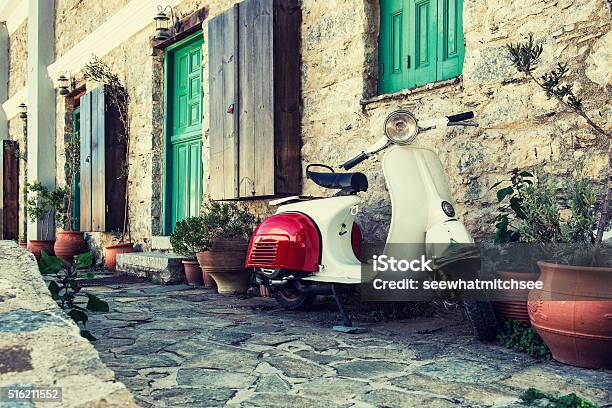 Old Scooter Parked By The Wall Stock Photo - Download Image Now - Moped, Motor Scooter, Italian Culture