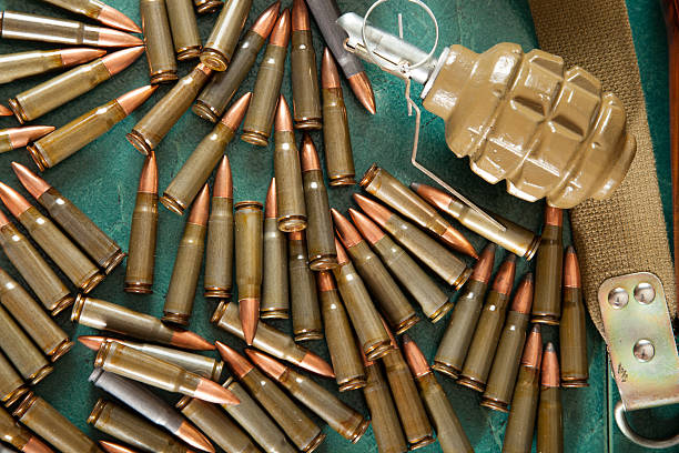 istock Ammunition and cartridges on green background 516211800