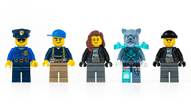 Muenster, Germany - March 8th 2015: A group of five various Lego mini characters isolated on white. Lego is a popular line of construction toys manufactured by the Lego Group.