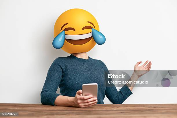 Emoji Head Woman Sitting At Desk Stock Photo - Download Image Now - Emoticon, Laughing, Human Face