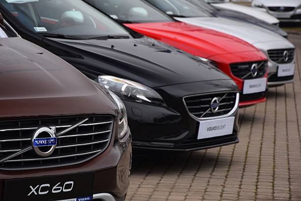 Volvo cars in a row Warsaw, Poland - February 18th, 2015: Exposition of Volvo cars on the parking. These vehicles are the ones of the most popular premium cars in Europe. volvo stock pictures, royalty-free photos & images