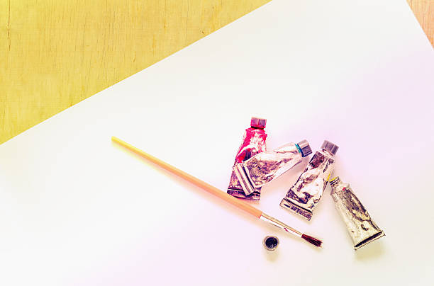 istock Color water with paint brush and paper 516216670