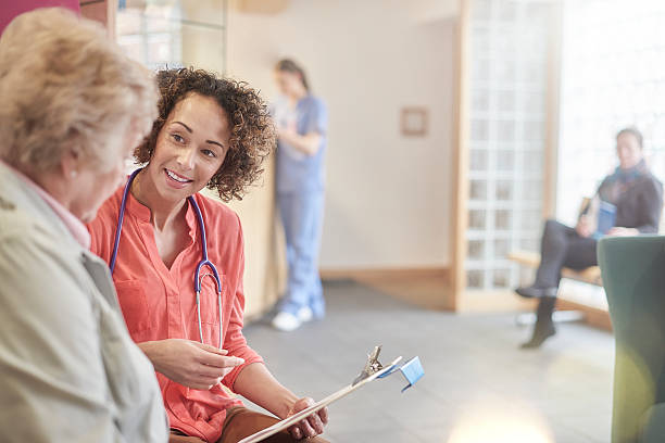 istock friendly female doctor with patient 516216888