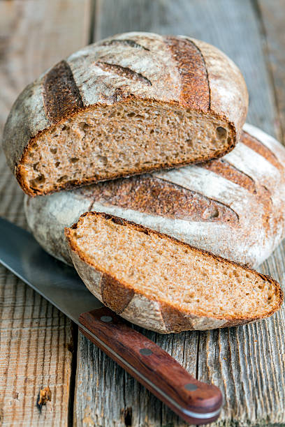 istock Fresh homemade bread and knife. 516217728
