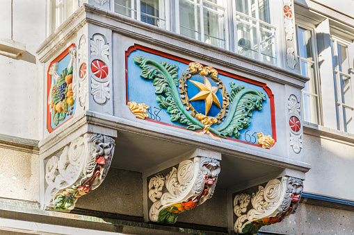 St Gallen, Switzerland - September 28, 2014: A decorated bay window in Spisergasse, in the old town of St Gallen, a city famous for its well maintained old town, rich in half-timbered houses, ancient palaces and bay windows.