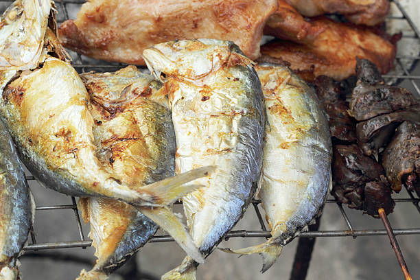 istock lot of mackerel on the grill 516218703