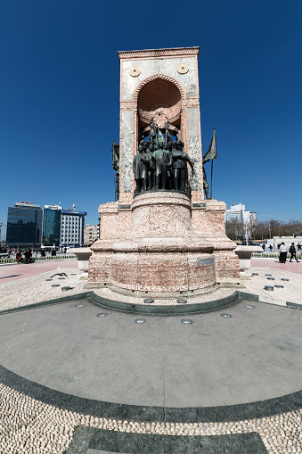 Istanbul, Turkey - March 18, 2016: People walk around Republic Monument at Taksim Square on Feb 5, 2012 in Istanbul. The monument honoring the leaders of the struggle for independence was unveiled in 1928.