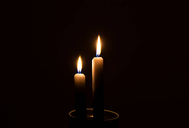istock Two candles in the dark 516219538