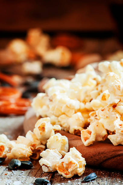 istock Sweet popcorn, salted cookies, sunflower seeds 516219940