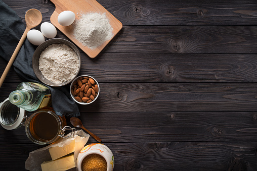 Ingredients for baking on a wooden background top view