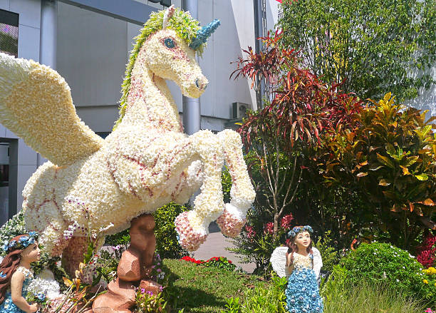 istock Unicorn created by flowers with fairy 516221241