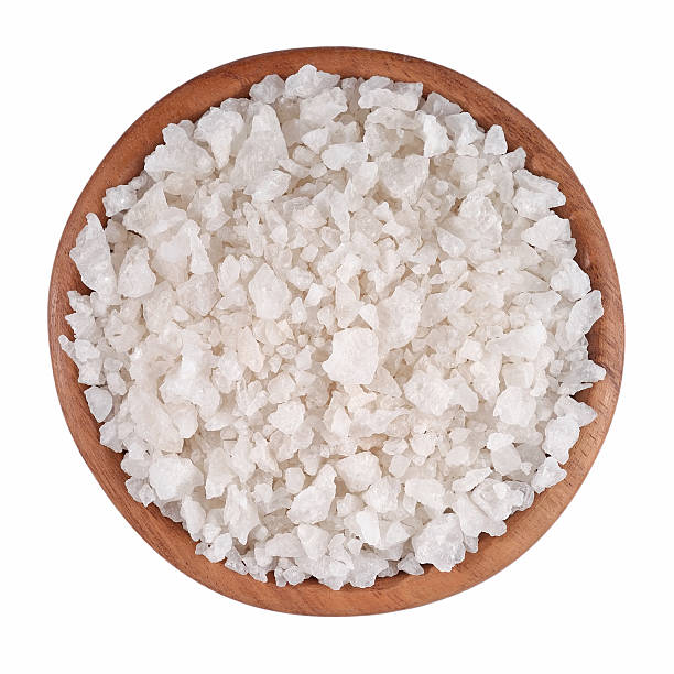 istock Sea salt in a wooden bowl on a white 516221603